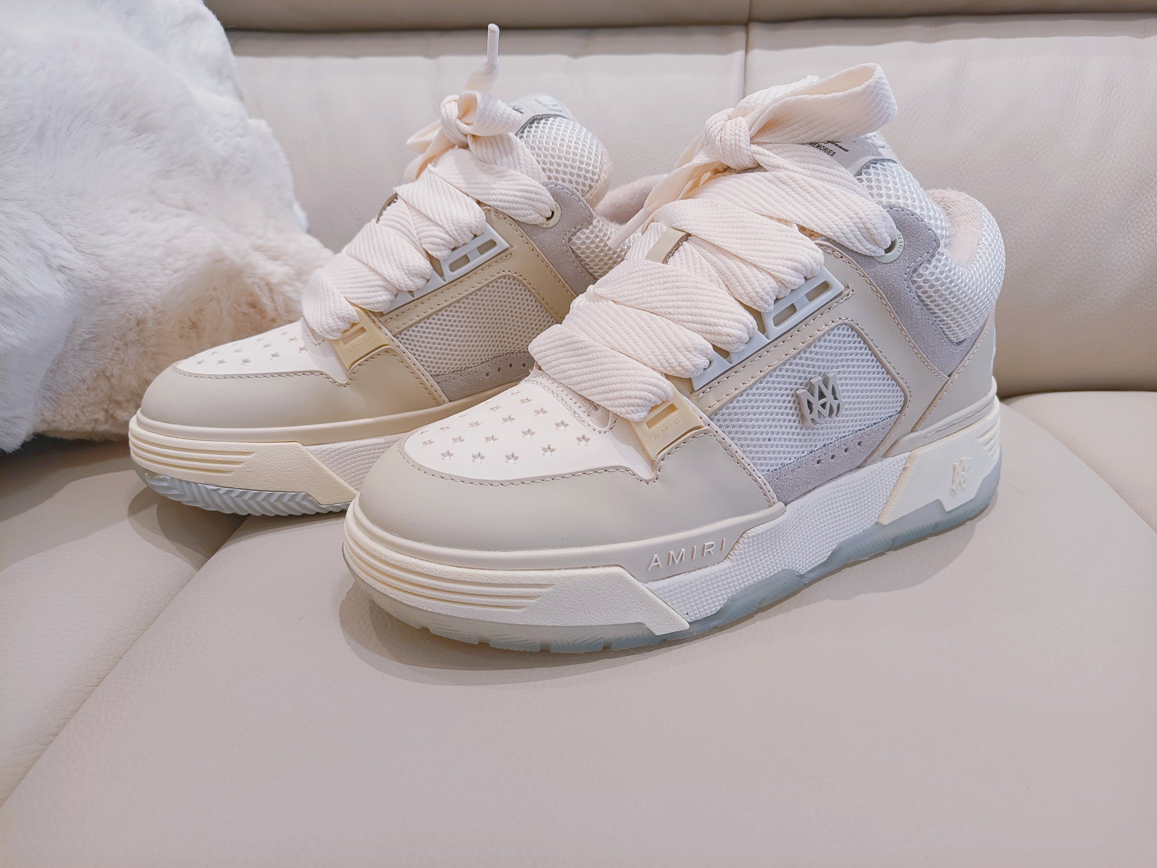 White and light beige lace-up sneakers with padded collar and side logo patch