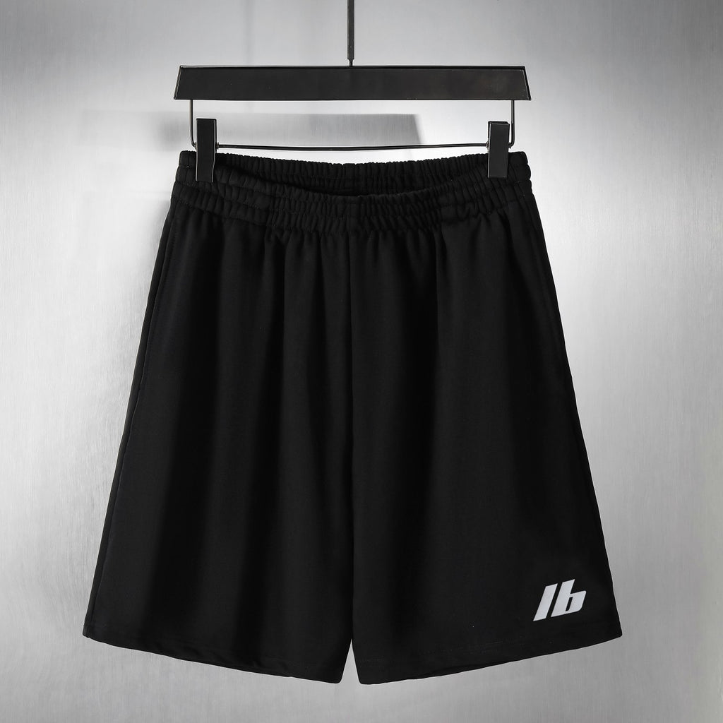 Balenciaga pants in black with elastic waistband and small logo on front leg