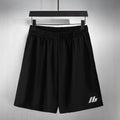 Balenciaga pants in black with elastic waistband and small logo on front leg