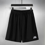 Balenciaga pants in black with elastic waistband and small logo on front leg