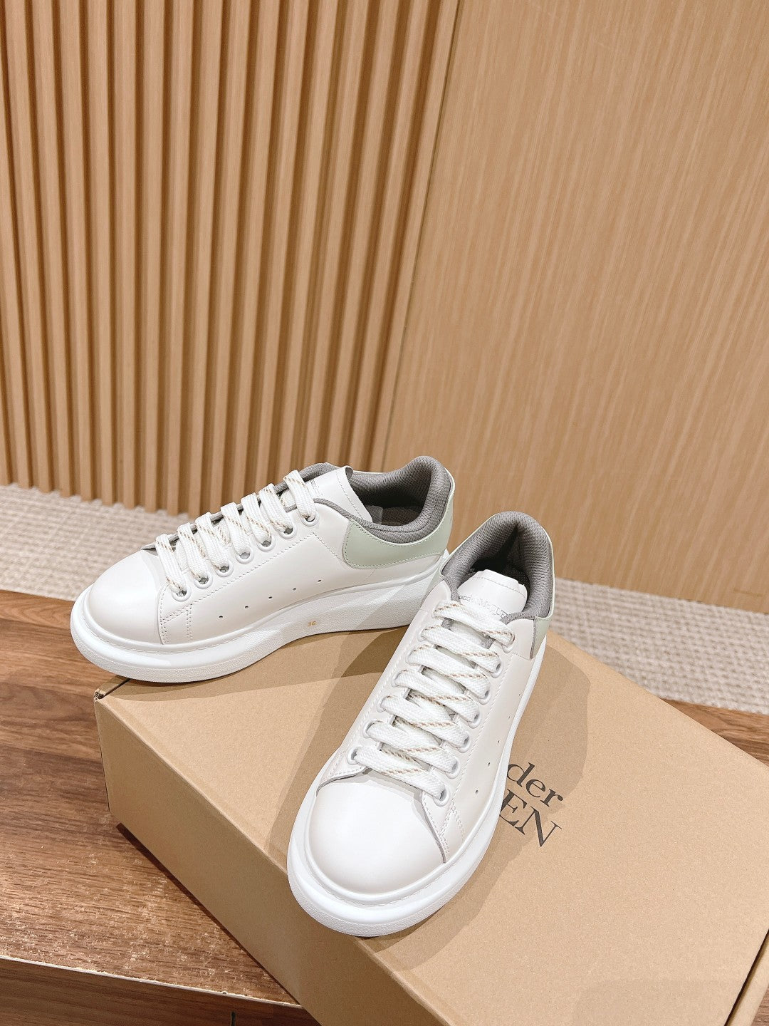 Alexander McQueen white sneakers with gray heel lining, lace-up design