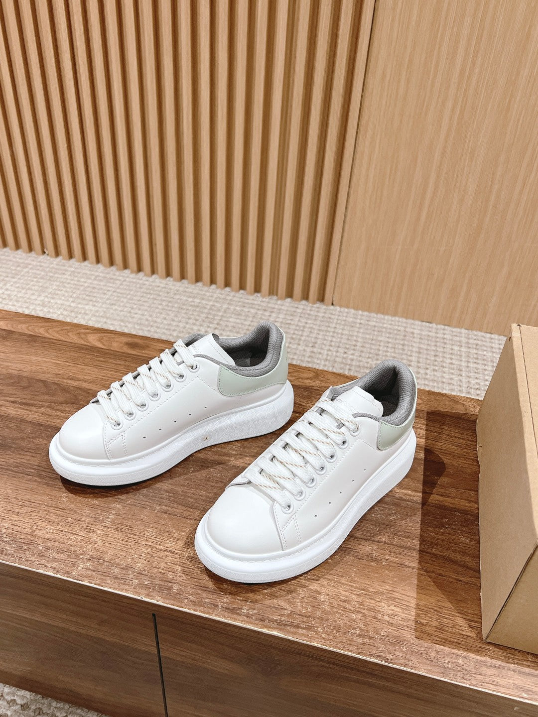 Alexander McQueen white sneakers with gray accents, lace-up and rubber sole