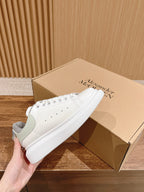 Alexander McQueen white sneakers, gray side panels, perforated toe