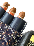 Small Goyard patterned pouch bag with navy leather side, embossed branding, and slots