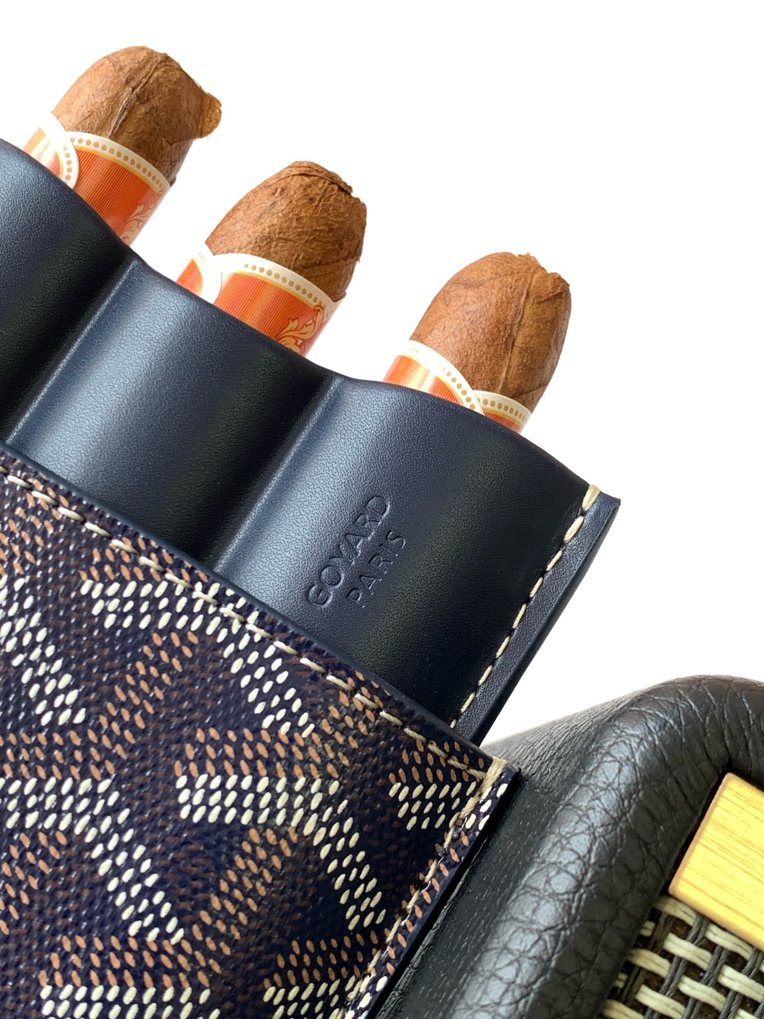 Small Goyard patterned pouch bag with navy leather side, embossed branding, and slots