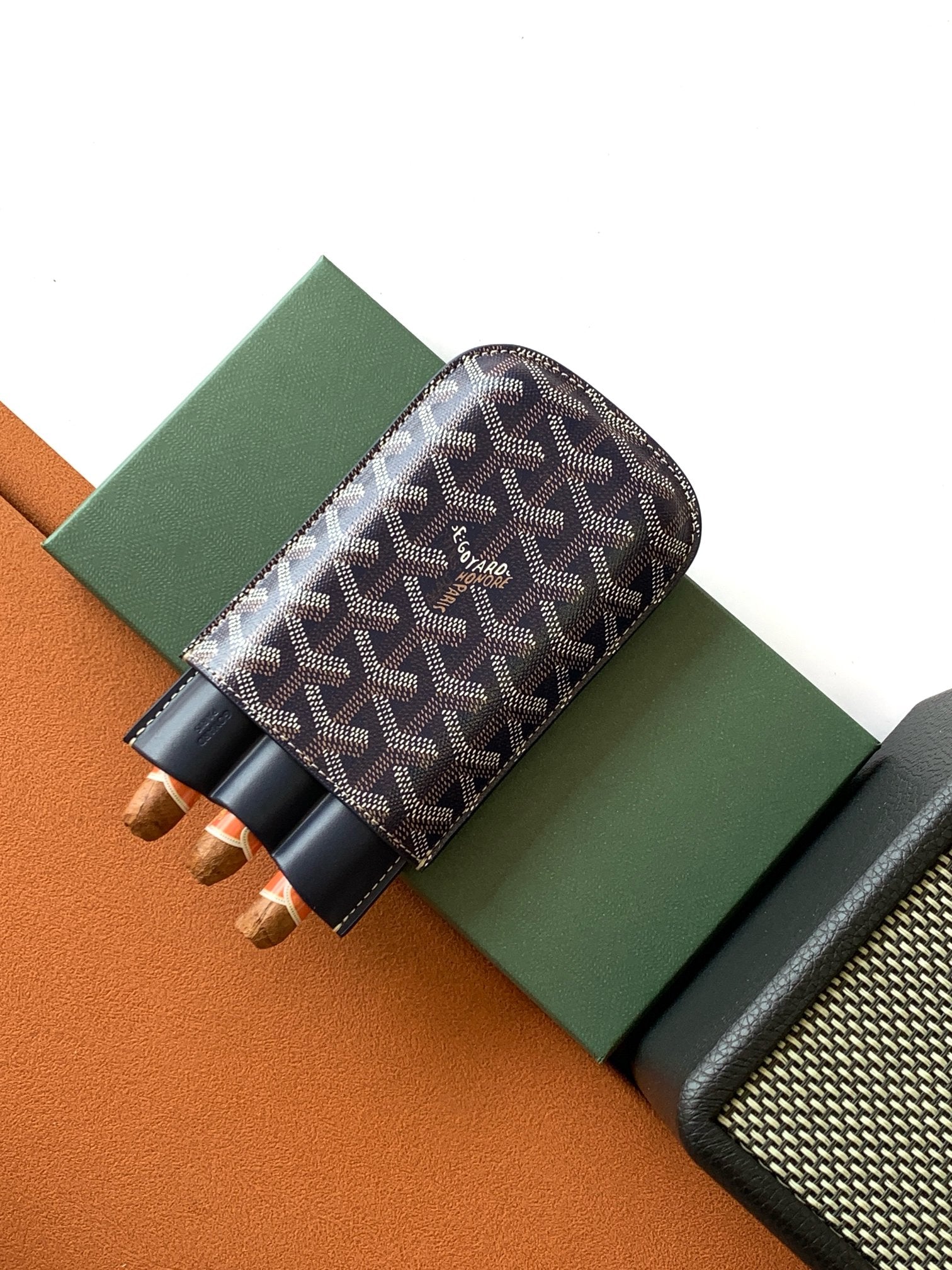 Small Goyard patterned pouch with navy leather trim and multiple inner slots