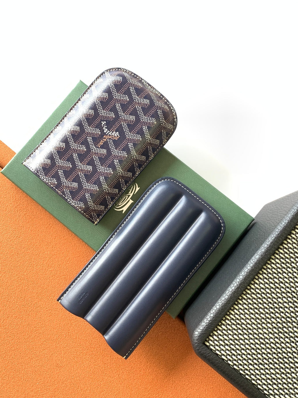 Small Goyard patterned pouch bag with navy leather interior slots