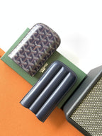 Small Goyard patterned pouch bag with navy leather interior slots