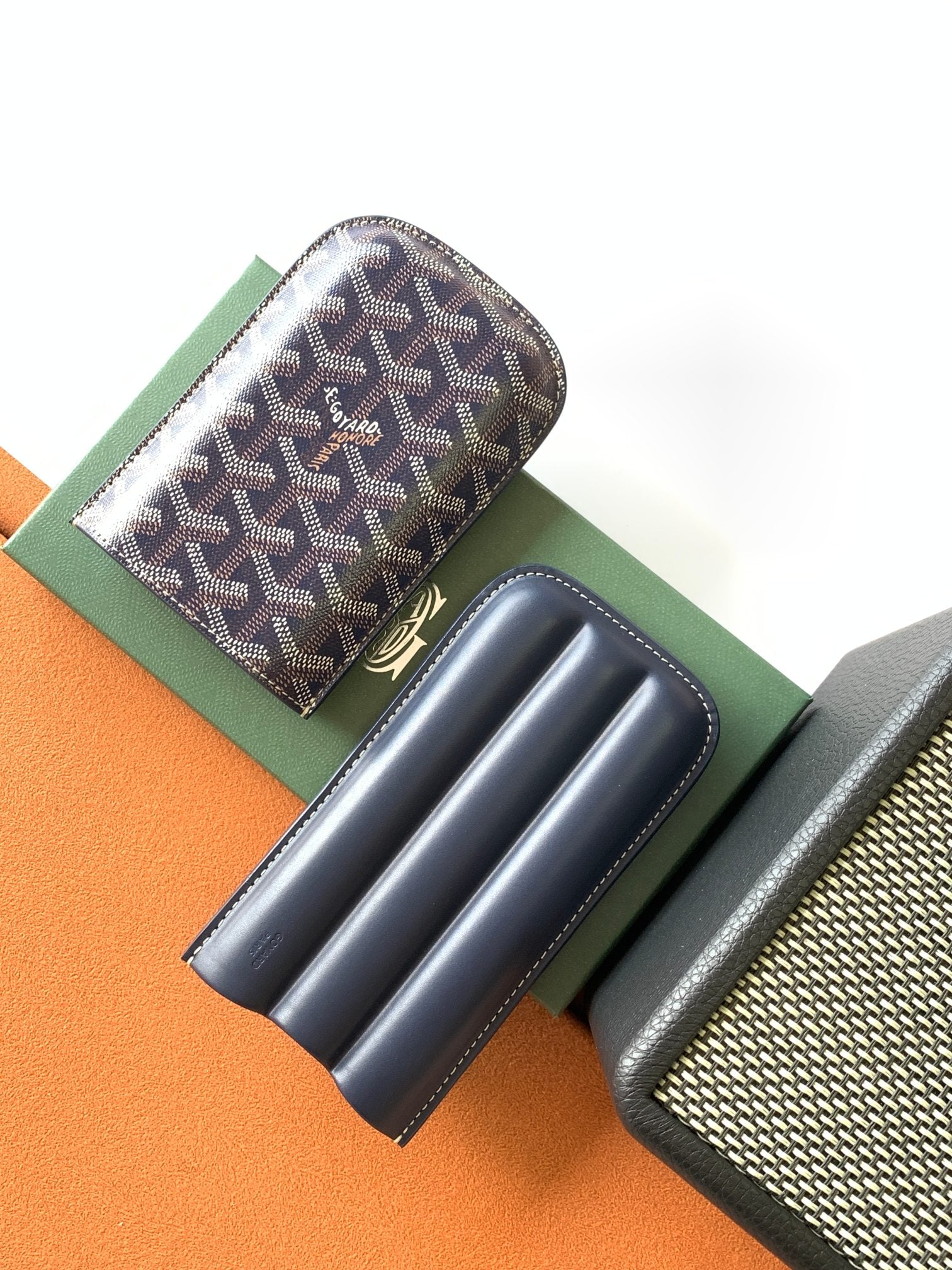 Small Goyard patterned pouch bag with navy leather interior slots