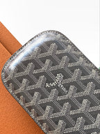 Goyard monogram mini pouch in gray with embossed logo at the center