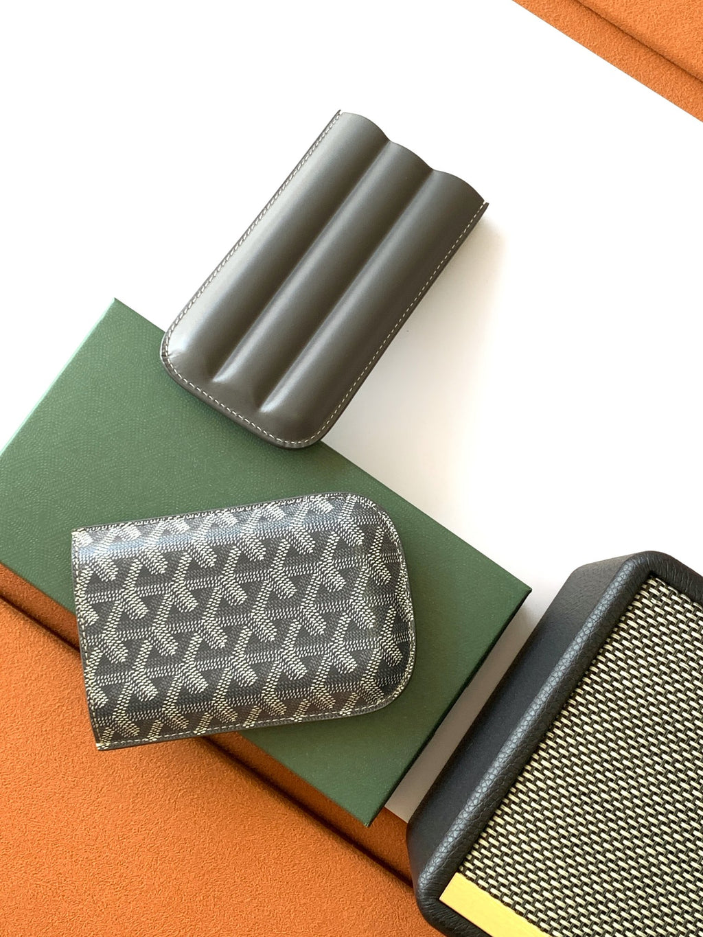 Compact Goyard-patterned pouch with curved top and gray leather pen-tube slots