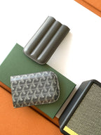 Compact Goyard-patterned pouch with curved top and gray leather pen-tube slots