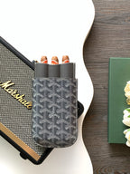 Goyard-patterned mini bag with multiple tube holders and gold-tone branding