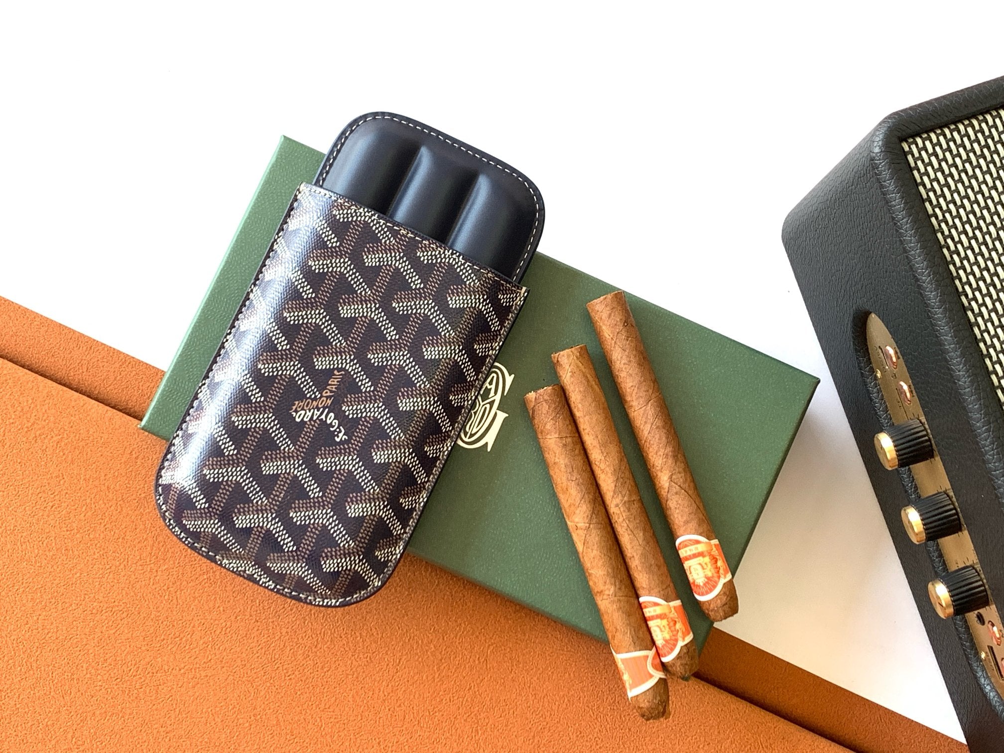 Small Goyard patterned pouch bag with navy leather trim and top zip