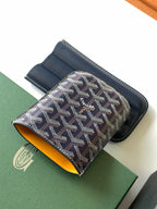 Small Goyard patterned pouch bag with navy leather trim and yellow interior lining