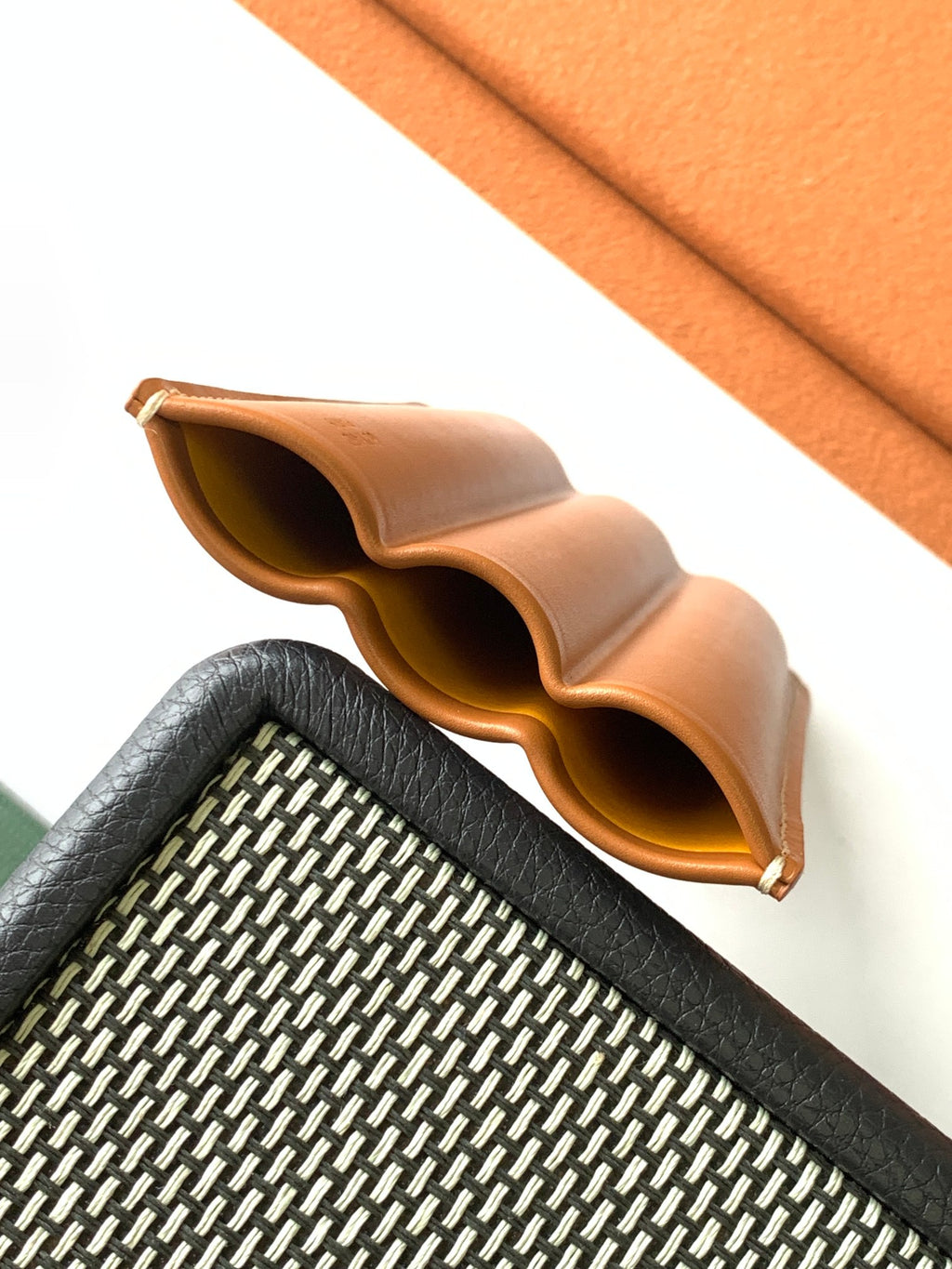 Goyard canvas bag open top with tan leather lining, curved edges, textured exterior
