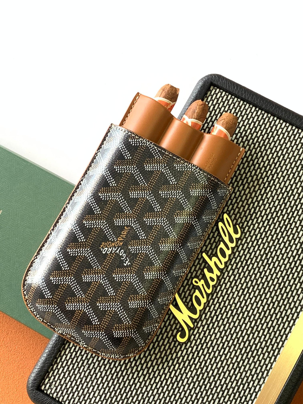 Goyard canvas bag with Goyardine pattern front and tan leather pockets, logo side detail