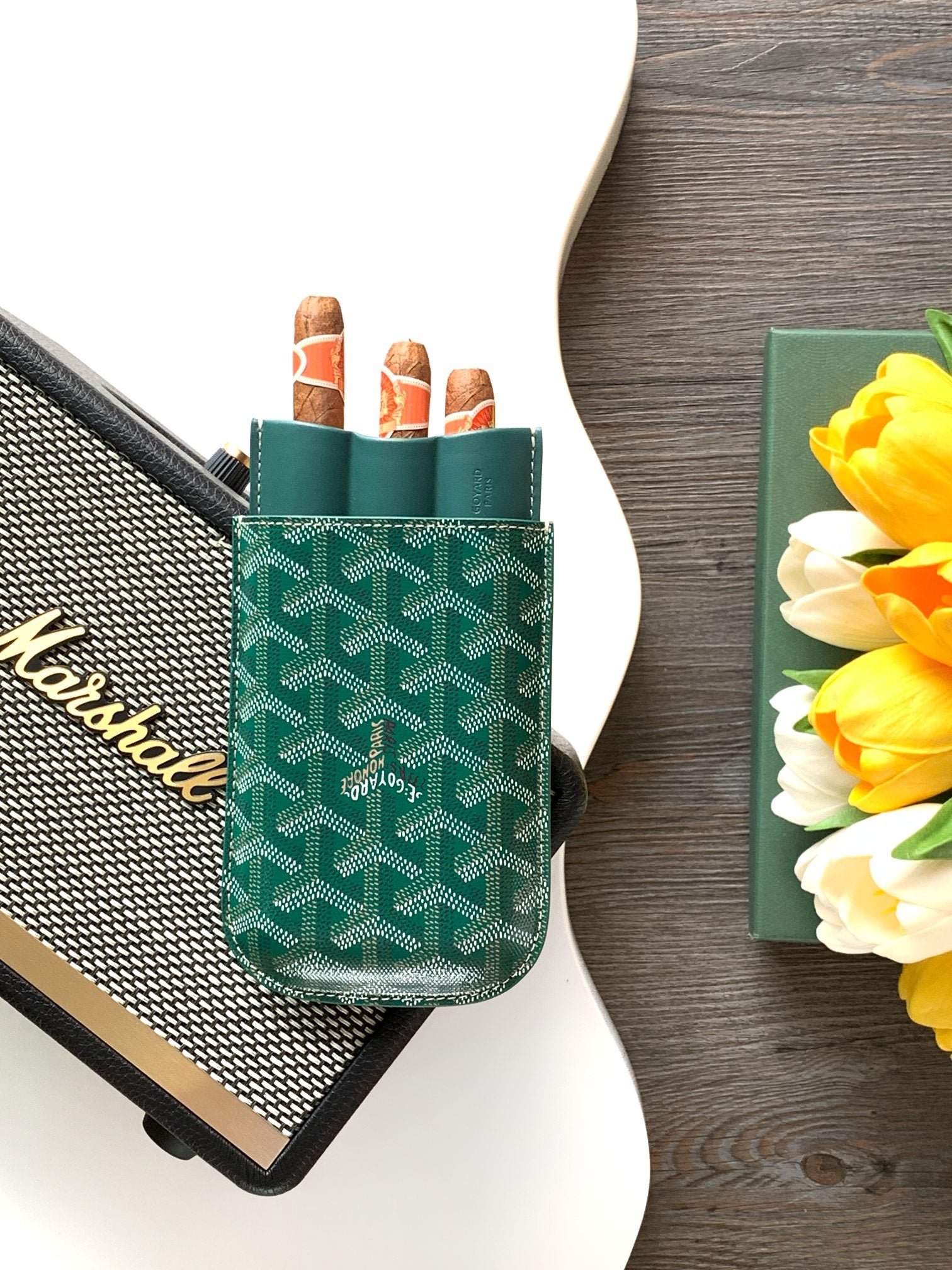 Goyard green patterned card holder standing upright with open slots