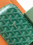 Goyard green patterned card holder with stitched edge and logo text