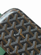 Goyard patterned bag close-up with logo text on the front panel