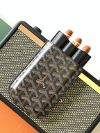 Goyard patterned bag on holder with multiple slots and black leather strap handle