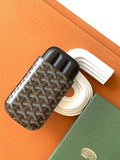 Goyard patterned bag with black leather trim, open top, and holder slot details