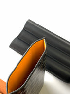 Goyard patterned bag open view showing orange interior lining