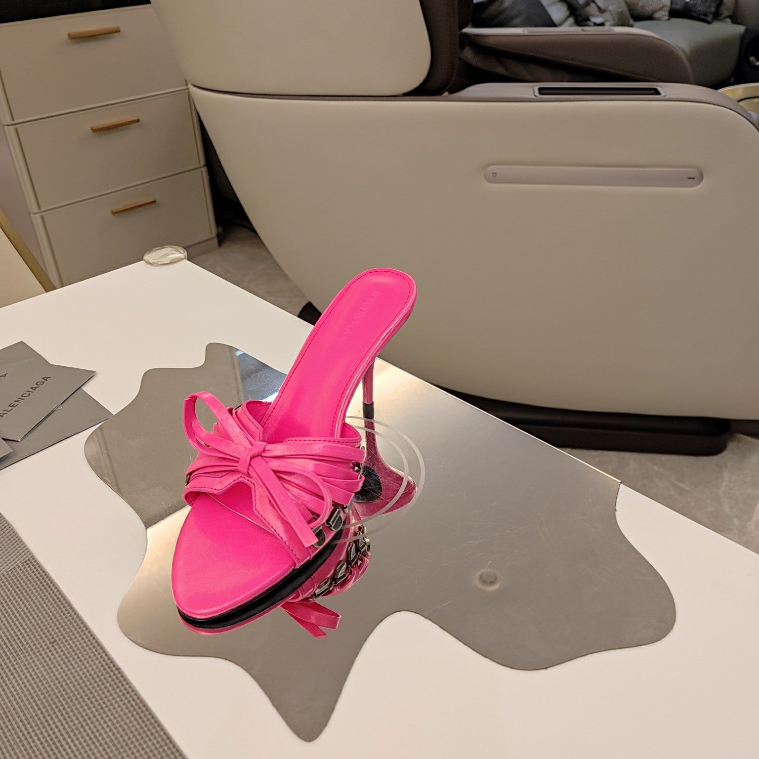 Balenciaga pink bow mule sandals with high stiletto heel, angled view