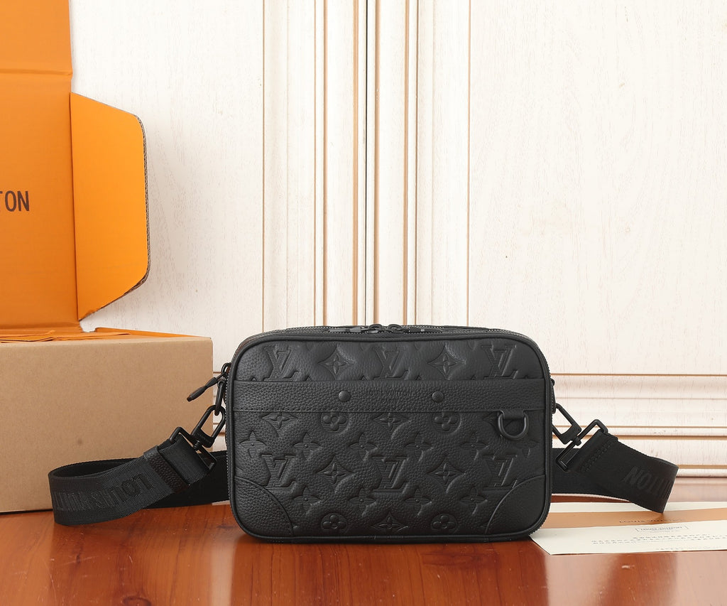Louis Vuitton crossbody bag, dark monogram embossed finish with top zipper and strap