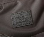 Crossbody bag brand label tag reading "Louis Vuitton Paris" and "made in France"