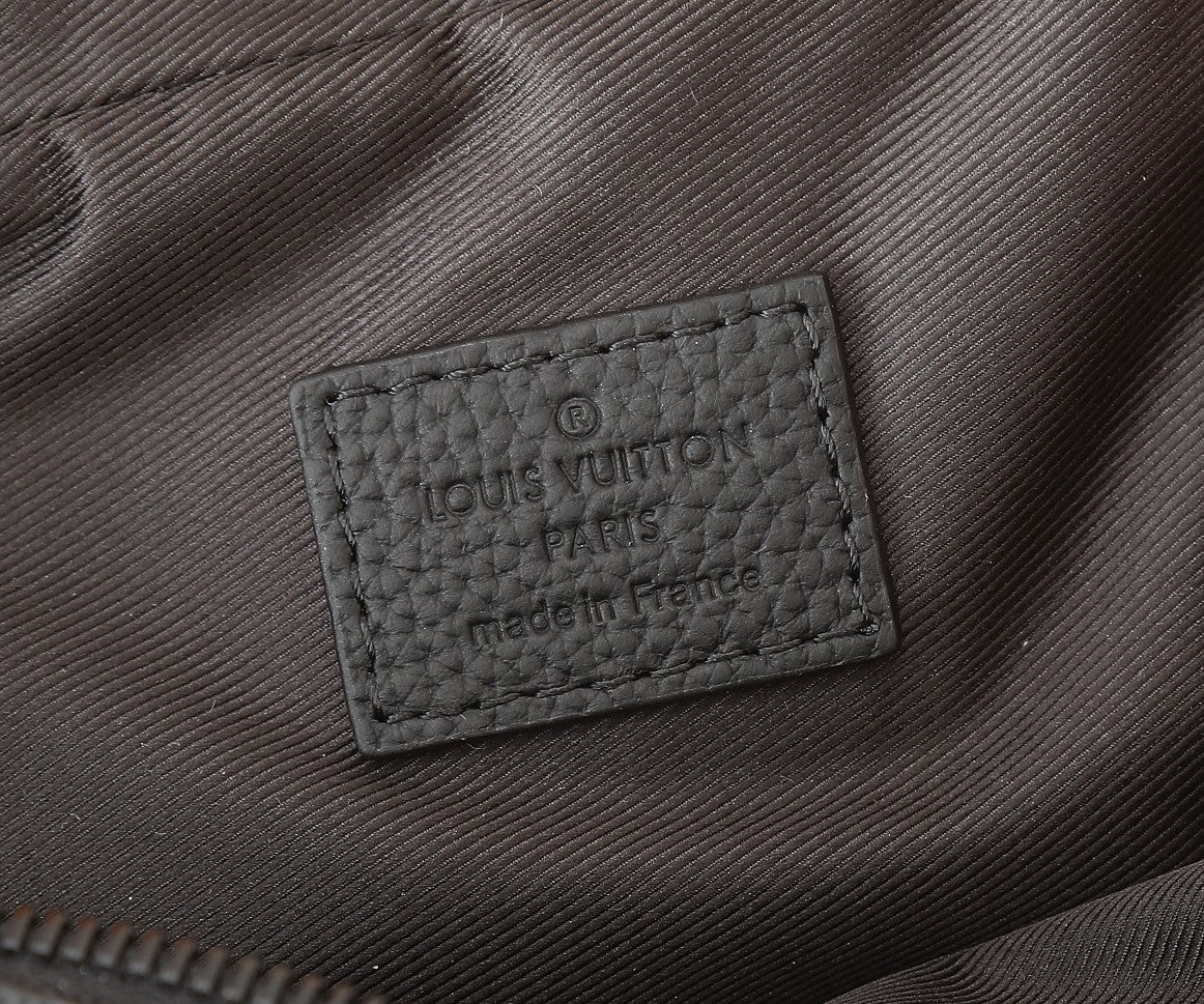 Crossbody bag brand label tag reading "Louis Vuitton Paris" and "made in France"