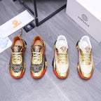 Luxury sneakers pair with white uppers, gold panels, green laces, and red/black sole trim