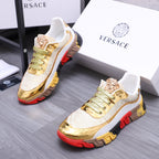 Luxury sneakers side view with white leather-look uppers, gold metallic toe, green laces, red sole