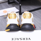 Luxury sneakers back view: white heel counters with gold trim and chunky sole