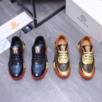 Low-top athletic sneakers, black with blue patterned panels and gold medallion