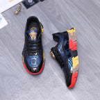 Low-top athletic sneakers, black with blue pattern and multicolor block sole
