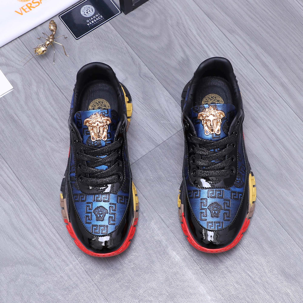 Low-top athletic sneakers, black with blue patterned stripe and gold emblems