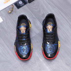 Low-top athletic sneakers, black with blue patterned stripe and gold emblems