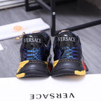 Low-top athletic sneakers, black and blue with rear logo print and chunky sole