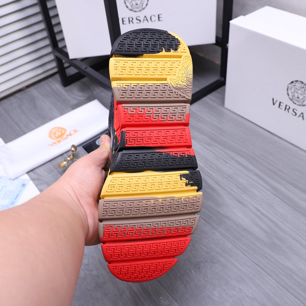 Pair of sneaker outsoles, multicolor tread in yellow, red, and beige