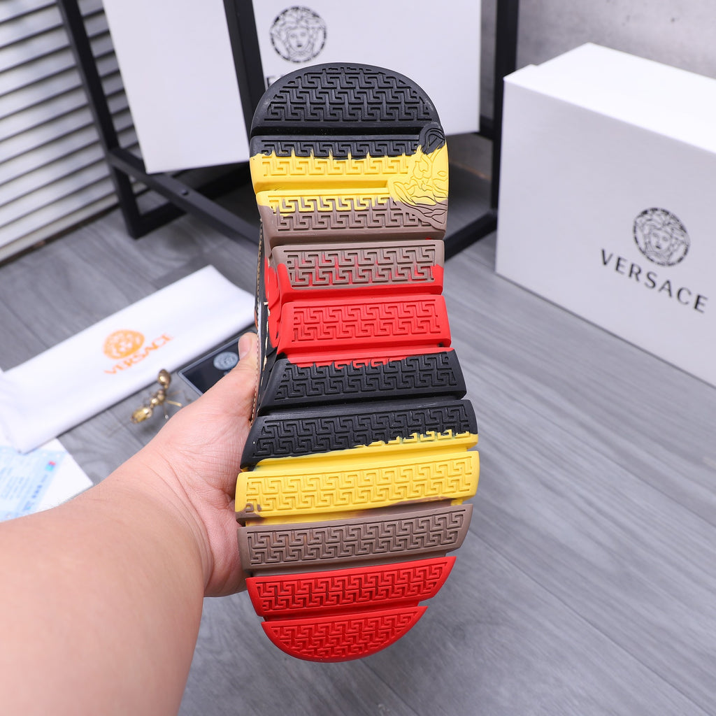 Luxury sneakers sole view, multi-color tread with Greek key pattern in yellow, red, black
