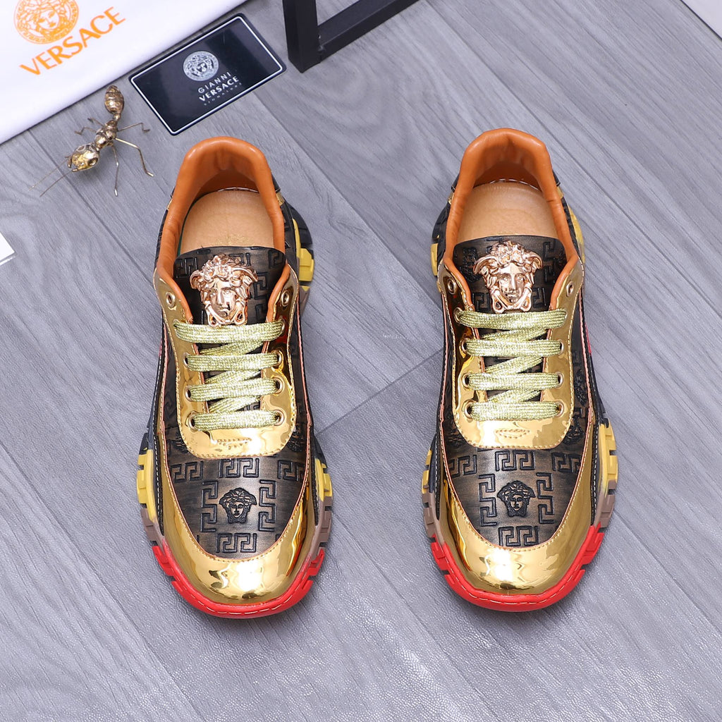 Luxury sneakers, gold toe, navy monogram panels, green laces, red/yellow chunky sole