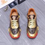 Luxury sneakers, gold toe, navy monogram panels, green laces, red/yellow chunky sole