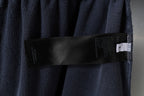 Balenciaga interior care label strip on dark gray shorts