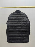 Moncler long dark puffer jacket back view with horizontal quilted panels