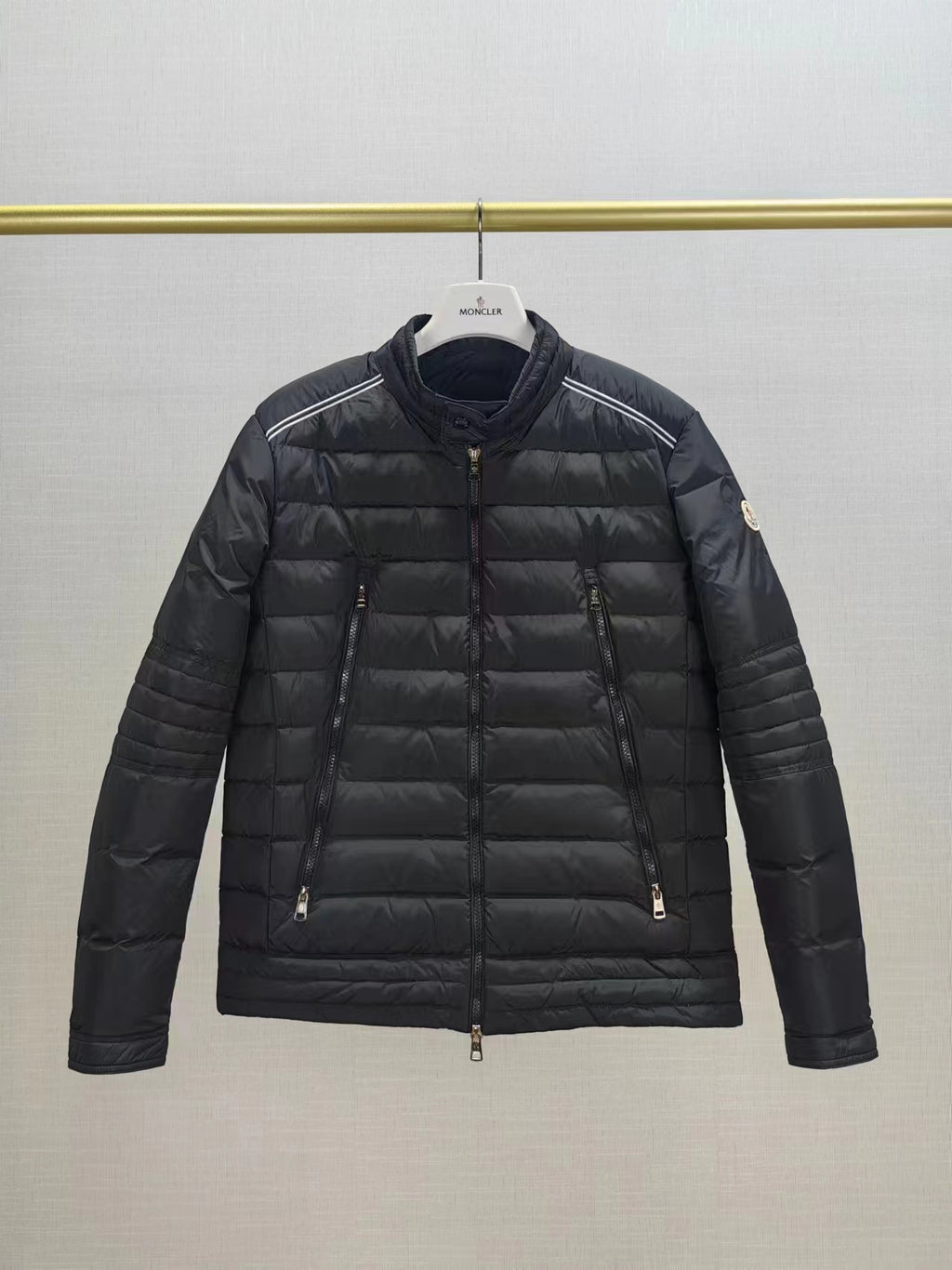 Moncler long dark puffer jacket with zip front and stand collar