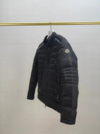 Moncler long dark puffer jacket, side profile with zip and logo patch