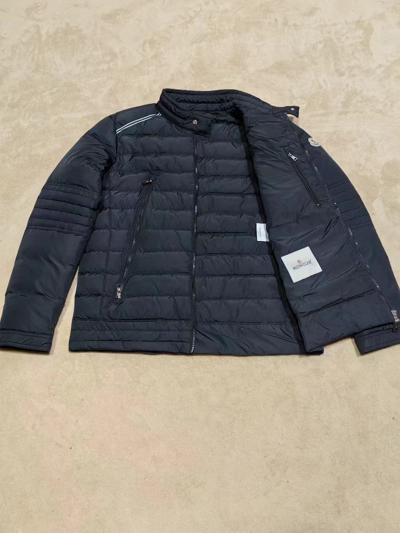 Moncler long dark puffer jacket with inner pocket panel and zip front