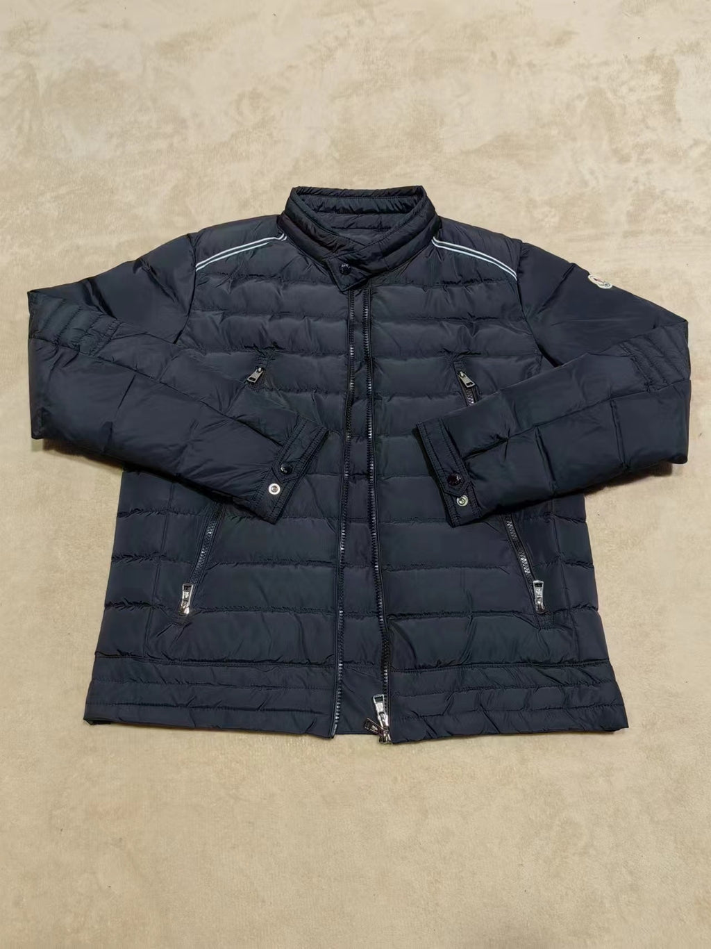 Moncler long dark puffer jacket with stand collar, zip front, quilted panels
