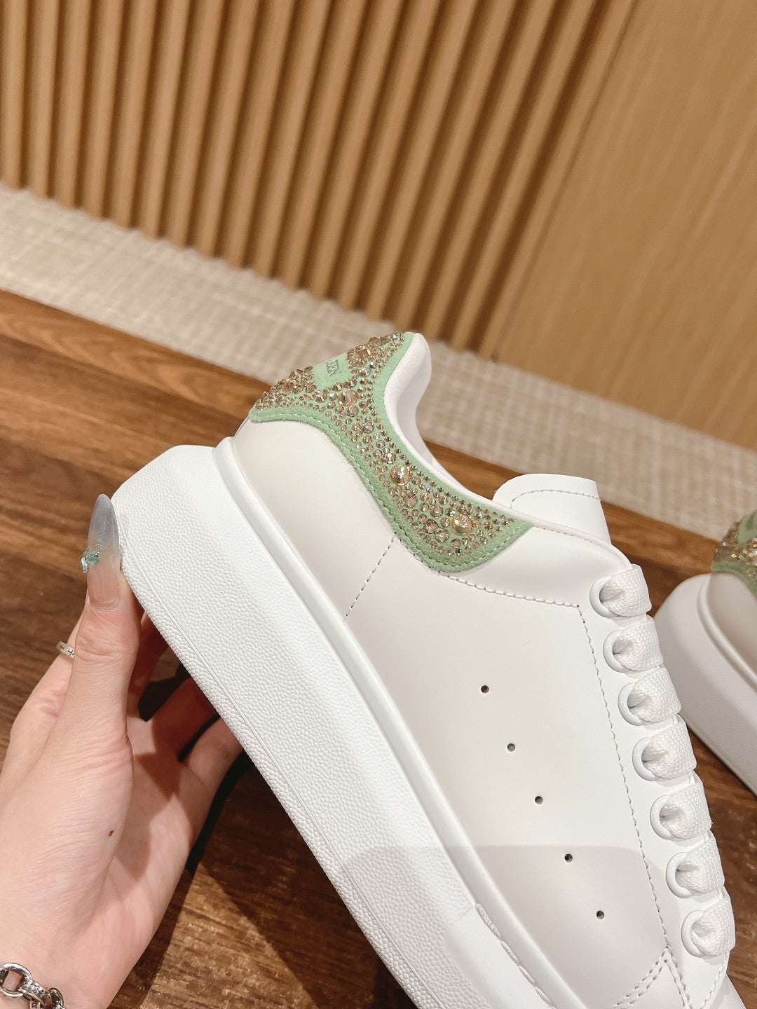 White leather sneaker with green glitter collar panel, lace-up front
